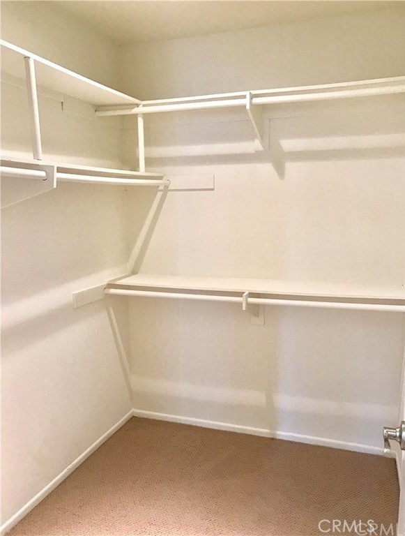 341 Stanford Court, Unit 26 Irvine, CA 92612 - Photo 14 of 24 a view of an empty walk in closet