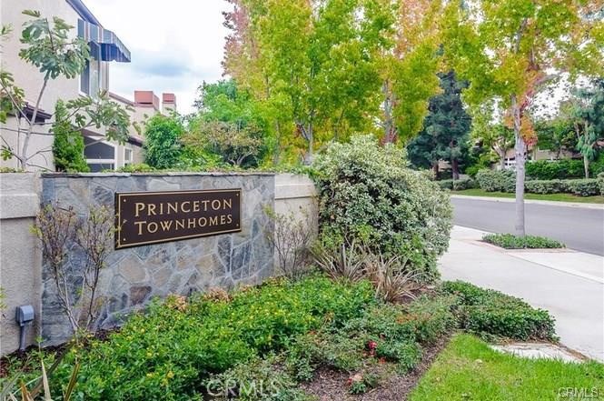 341 Stanford Court, Unit 26 Irvine, CA 92612 - Photo 15 of 24 a view of a street sign under a large tree