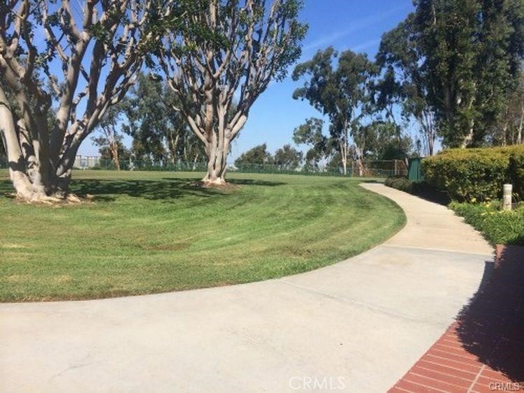 341 Stanford Court, Unit 26 Irvine, CA 92612 - Photo 18 of 24 a view of a golf course with a garden
