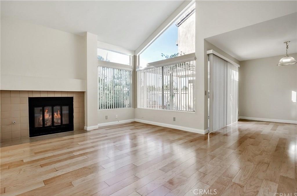 341 Stanford Court, Unit 26 Irvine, CA 92612 - Photo 2 of 24 a view of an empty room with wooden floor and a window