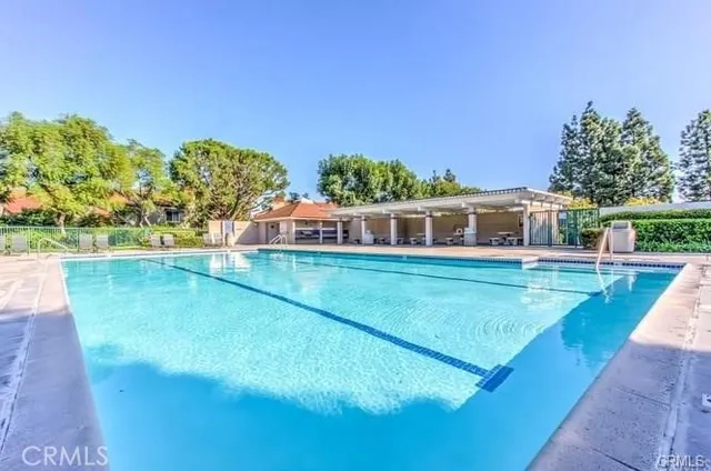 a view of a house with sitting area and a yard
