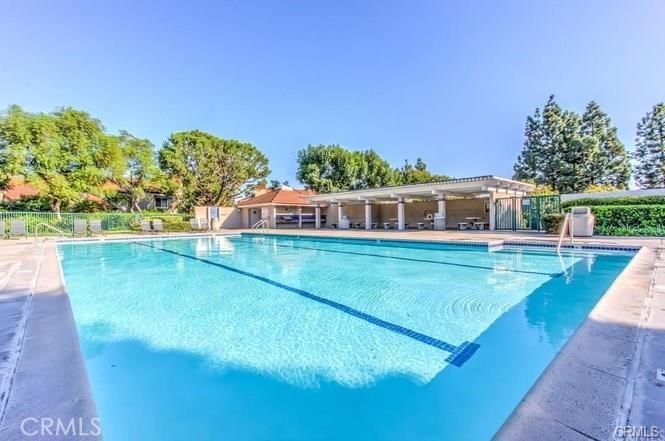 341 Stanford Court, Unit 26 Irvine, CA 92612 - Photo 21 of 24 a view of a house with swimming pool