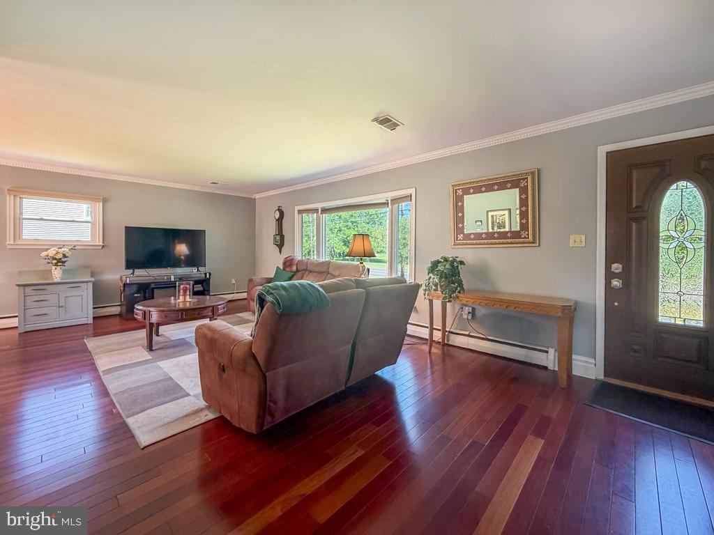 925 Big Oak Road Yardley, PA 19067 - Photo 10 of 51 a living room with furniture and a flat screen tv