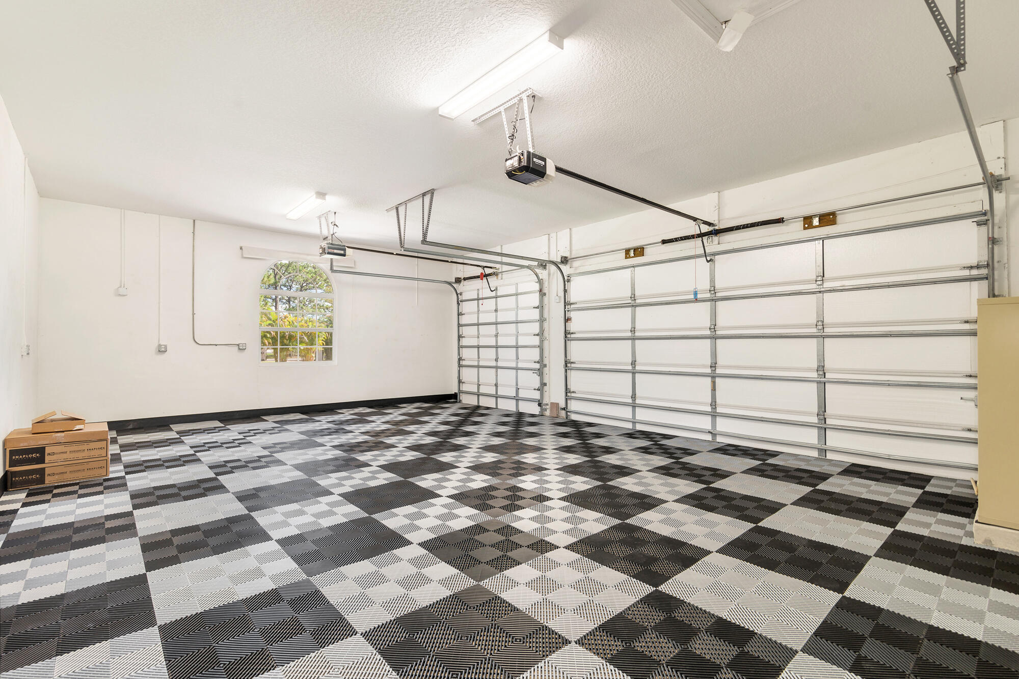 13095 Sand Ridge Road Palm Beach Gardens, FL 33418 - Photo 44 of 55 Custom Floor In 3 Car Garage