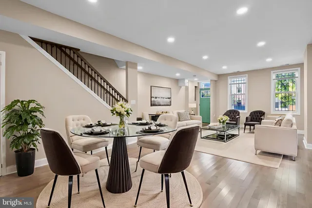 a view of a dining room with furniture window and wooden floor