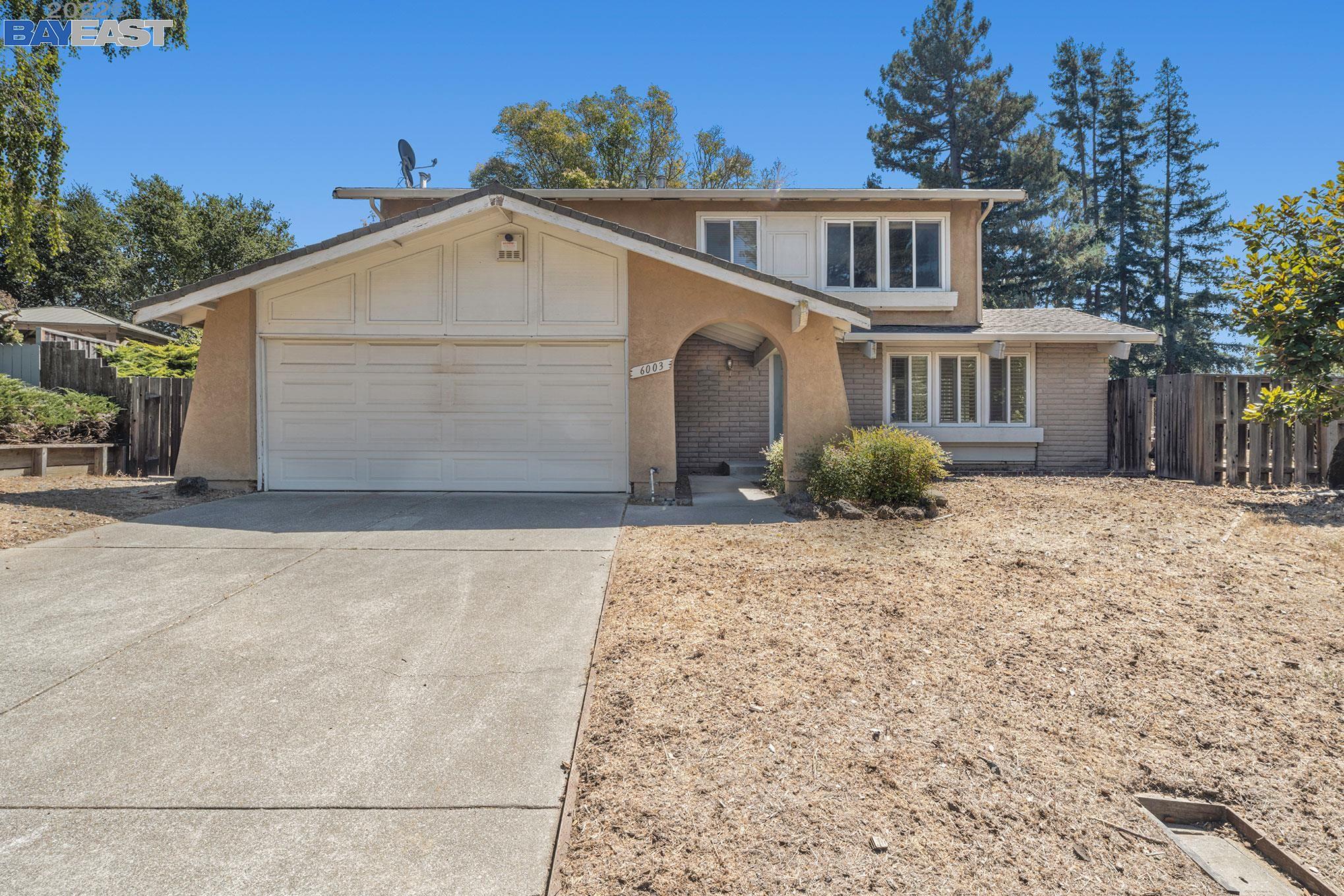 6003 Greenridge Road Castro Valley, CA 94552 - Photo 1 of 1 a front view of a house with a yard