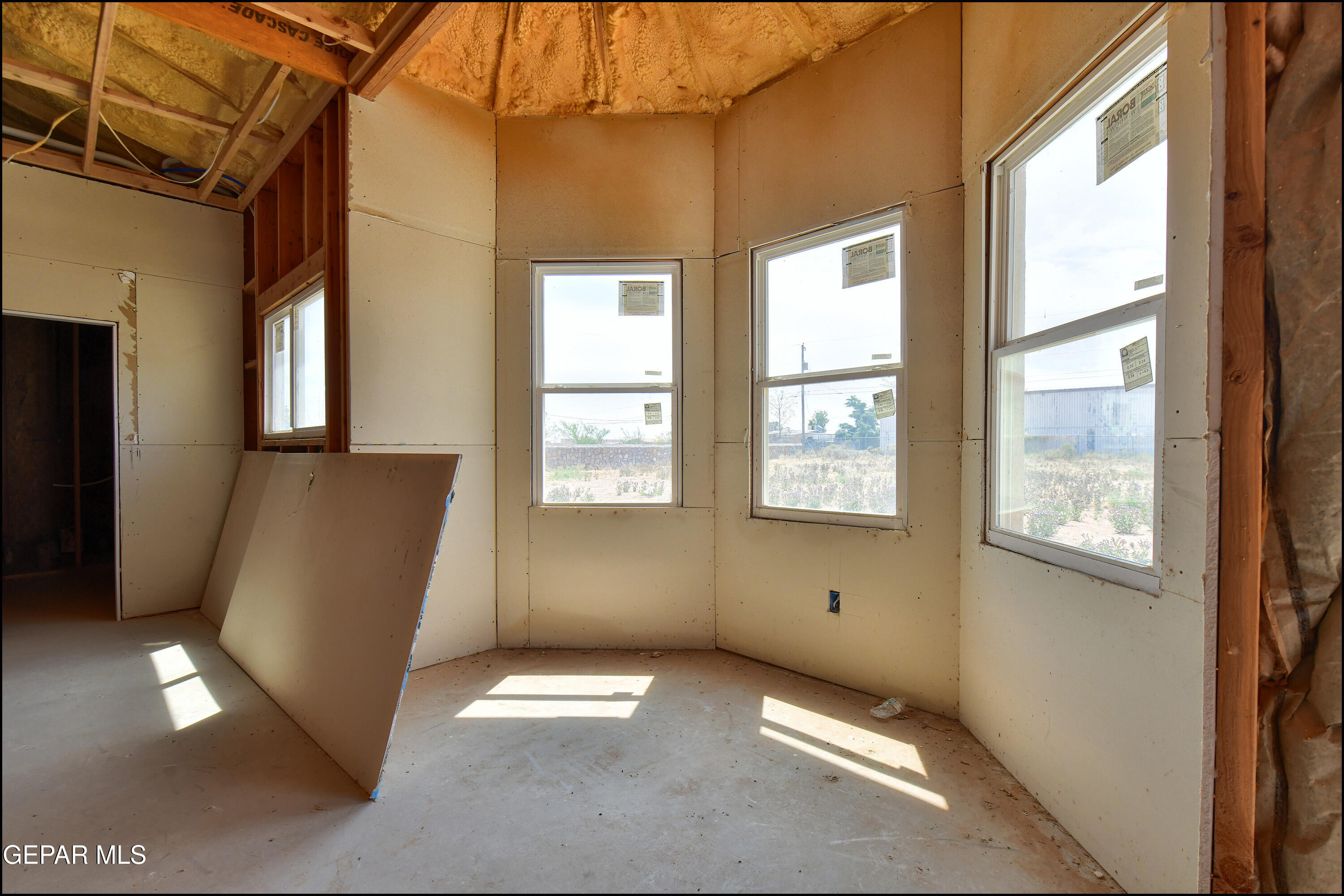 13360 Ayla Road El Paso, TX 79938 - Photo 15 of 48 a view of an empty room with a window