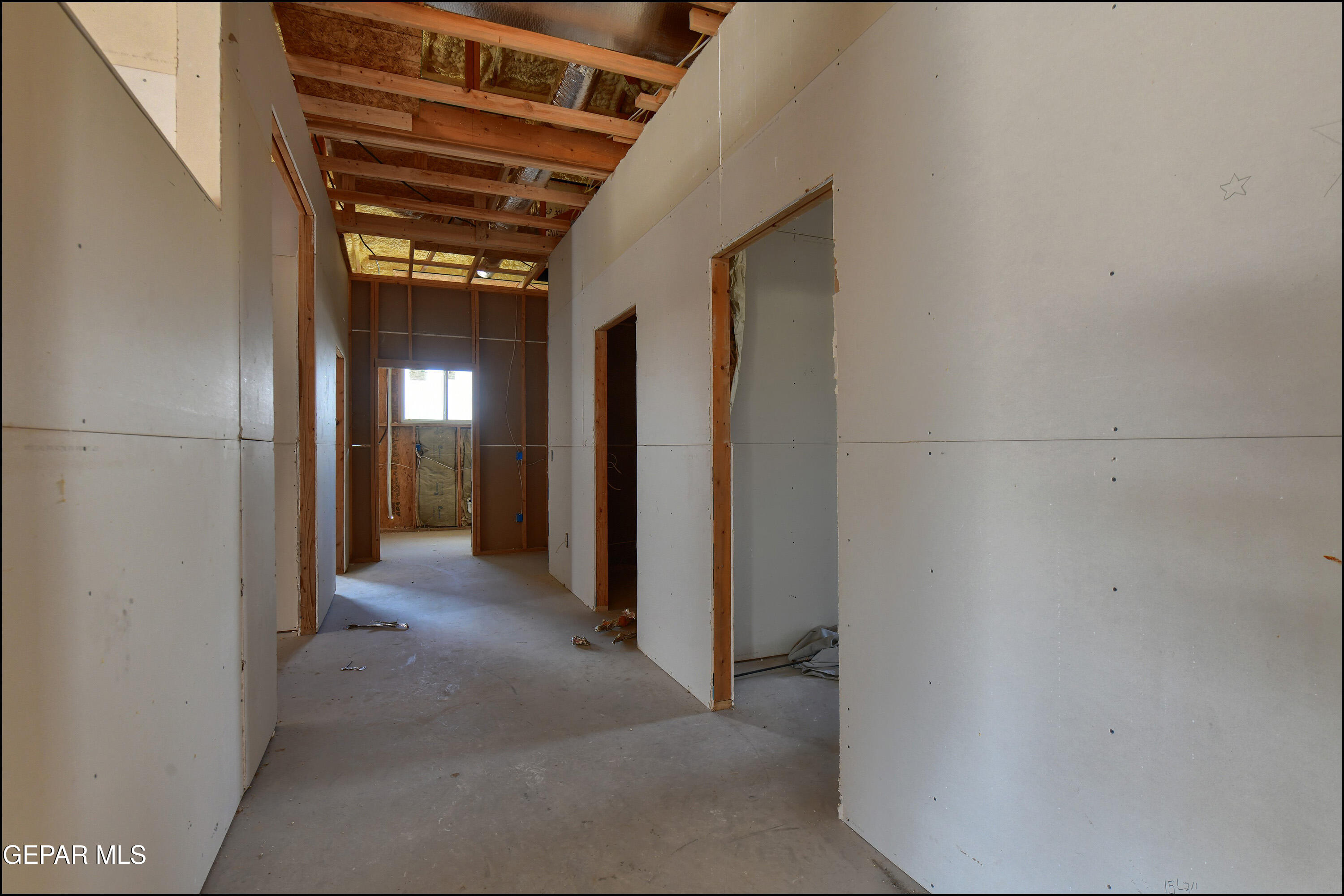 13360 Ayla Road El Paso, TX 79938 - Photo 24 of 48 a view of a hallway with wooden shelves