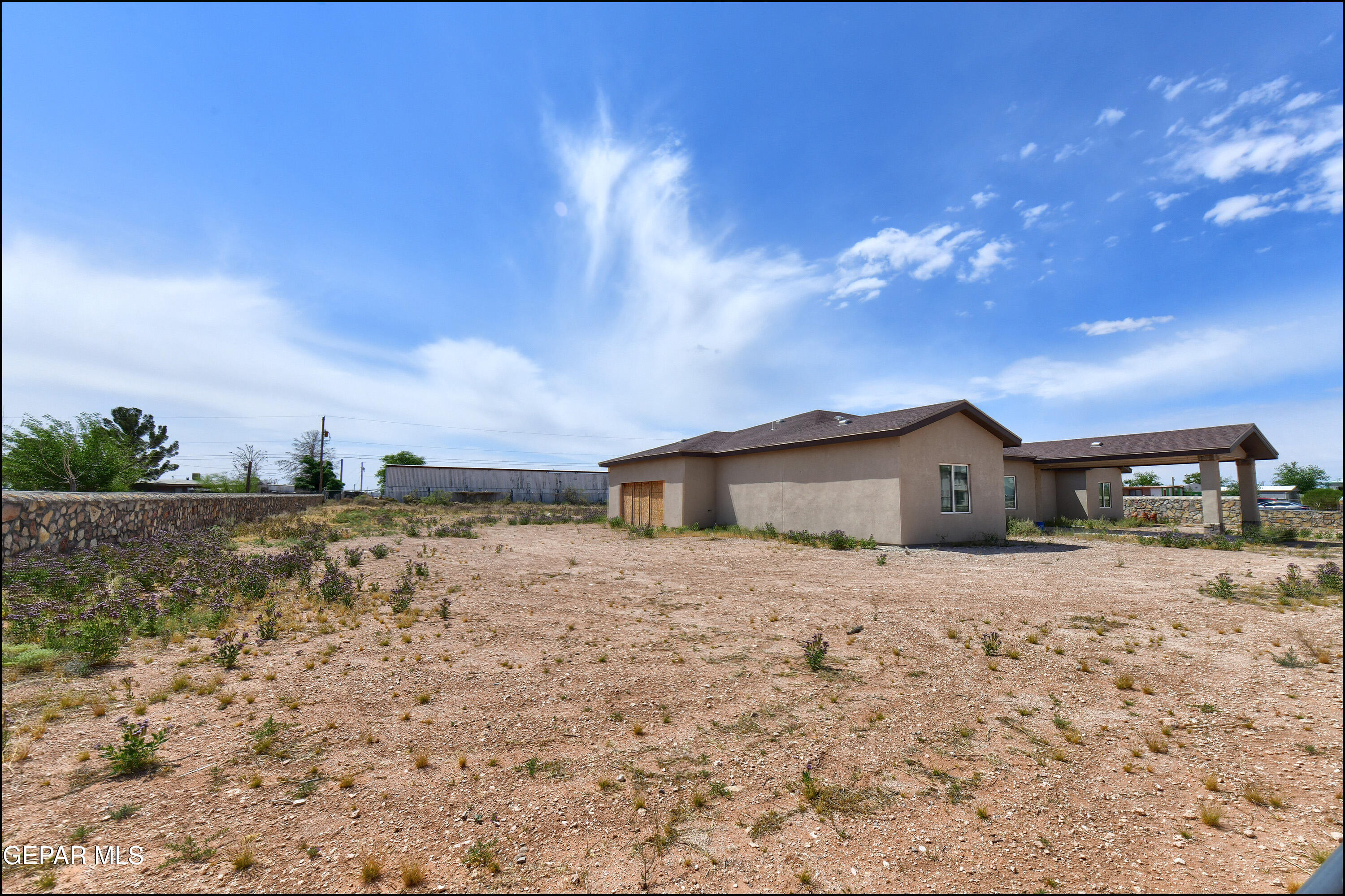 13360 Ayla Road El Paso, TX 79938 - Photo 5 of 48 a large house with a yard