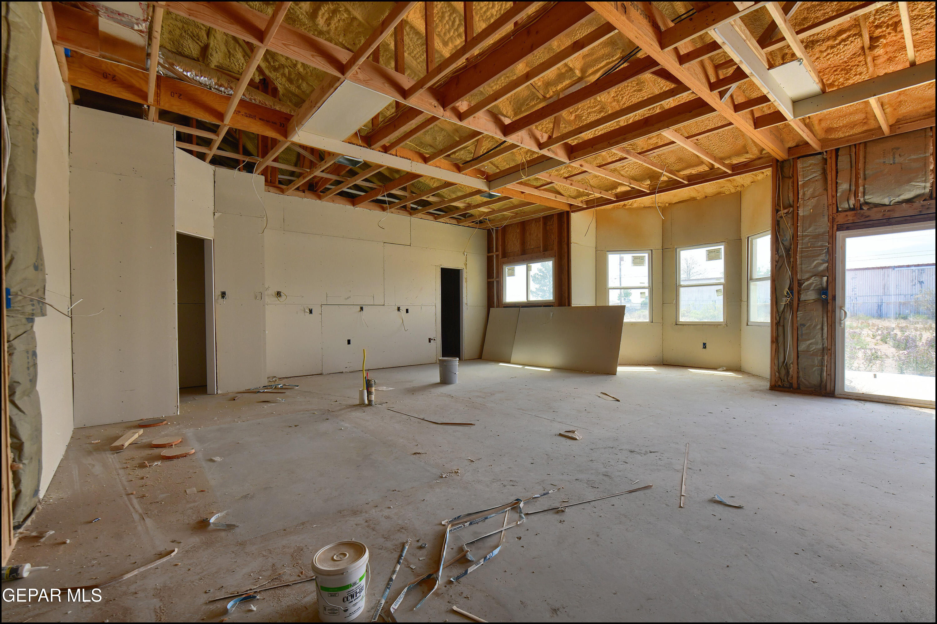 13360 Ayla Road El Paso, TX 79938 - Photo 9 of 48 a view of a livingroom with wooden floor and windows