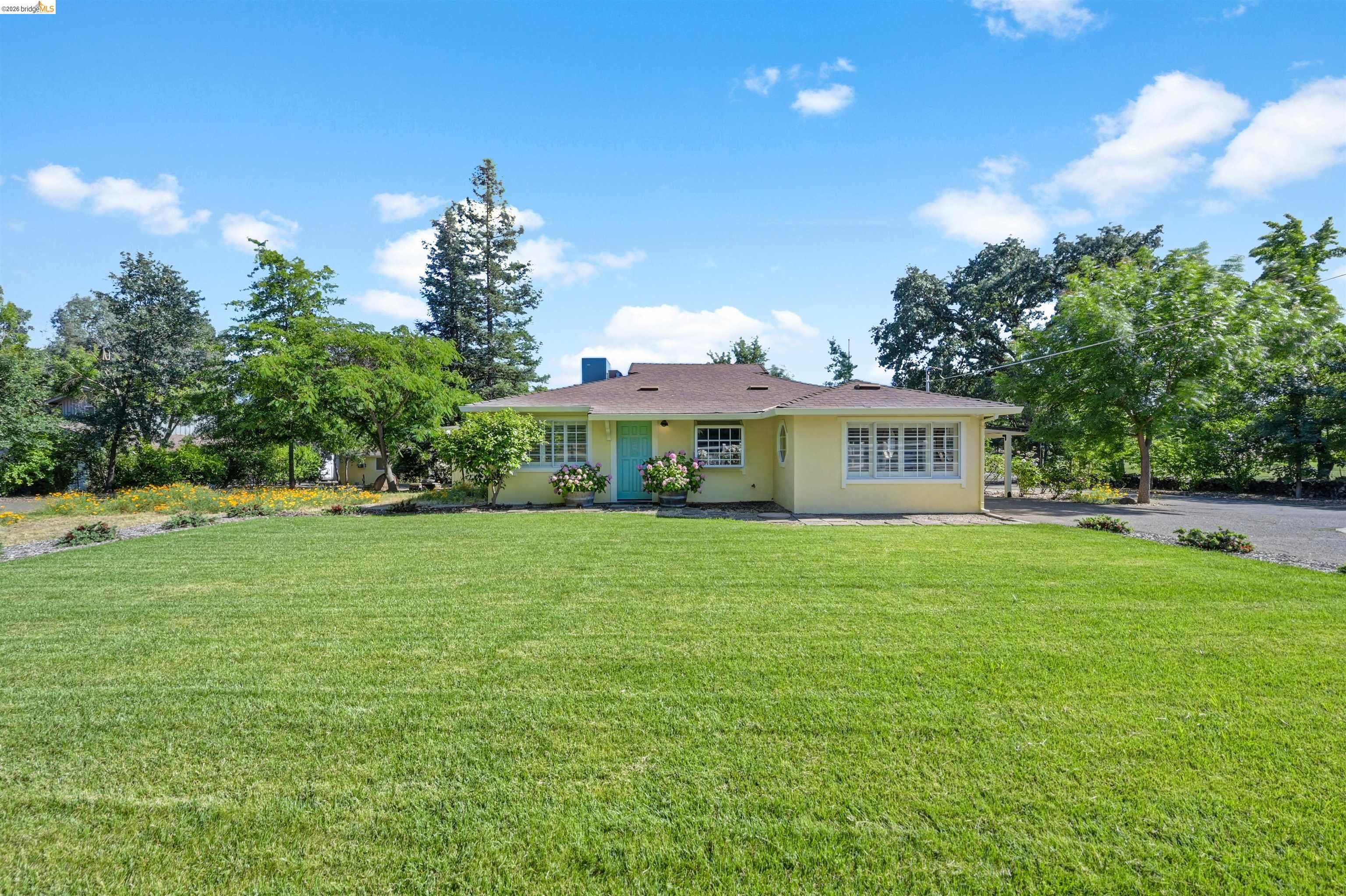 10474 Sheldon Road Elk Grove, CA 95624 - Photo 81 of 83 Expansive front lawn with mature trees and landscaping