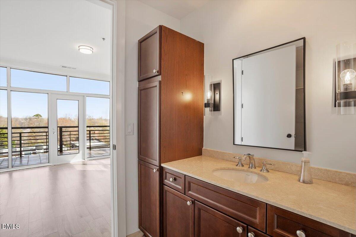 618 North Boylan Avenue, Unit 924 Raleigh, NC 27603 - Photo 12 of 33 a bathroom with a double vanity sink and a mirror