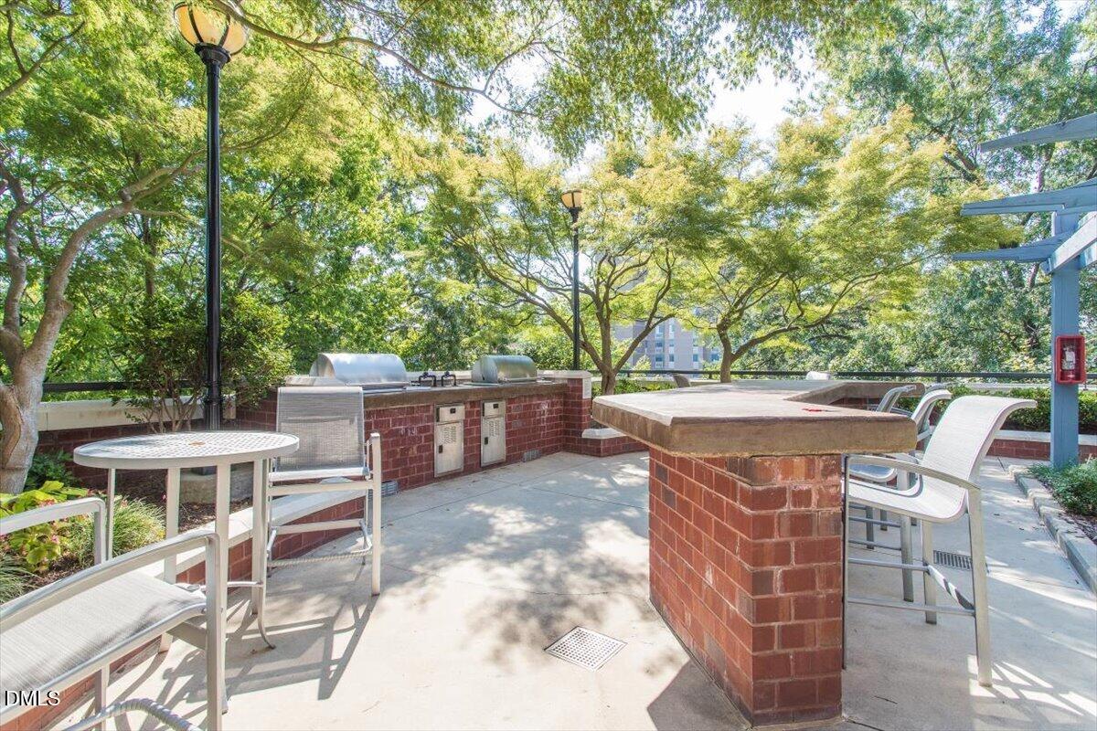 618 North Boylan Avenue, Unit 924 Raleigh, NC 27603 - Photo 25 of 33 a view of a chairs and table in the patio