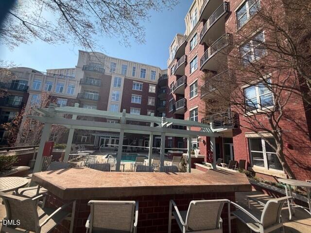 618 North Boylan Avenue, Unit 924 Raleigh, NC 27603 - Photo 26 of 33 a front view of a building with parking space