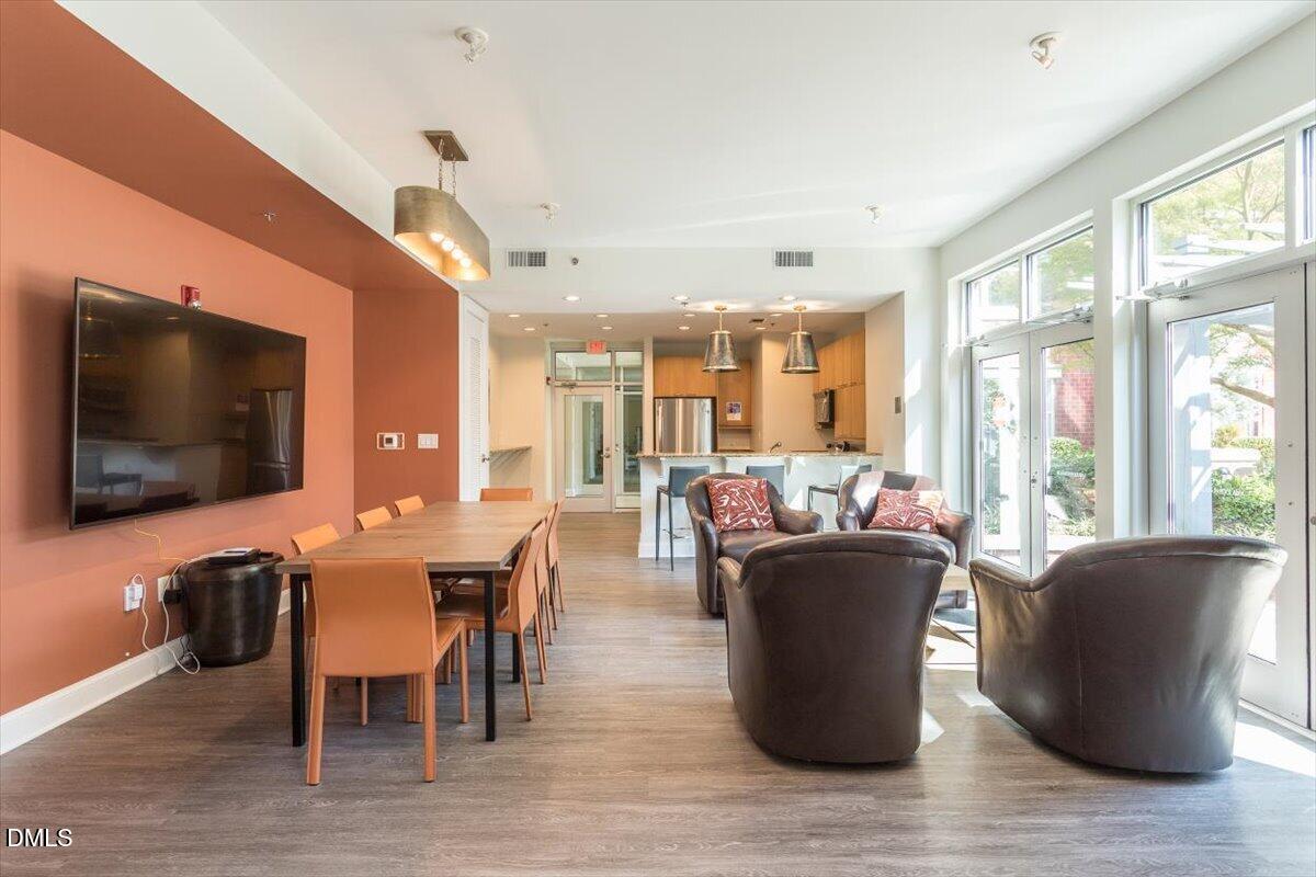 618 North Boylan Avenue, Unit 924 Raleigh, NC 27603 - Photo 28 of 33 a dining room with furniture window and wooden floor