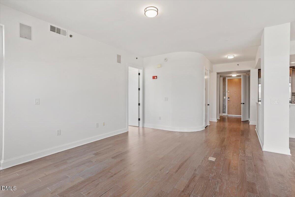 618 North Boylan Avenue, Unit 924 Raleigh, NC 27603 - Photo 9 of 33 a view of an empty room with wooden floor