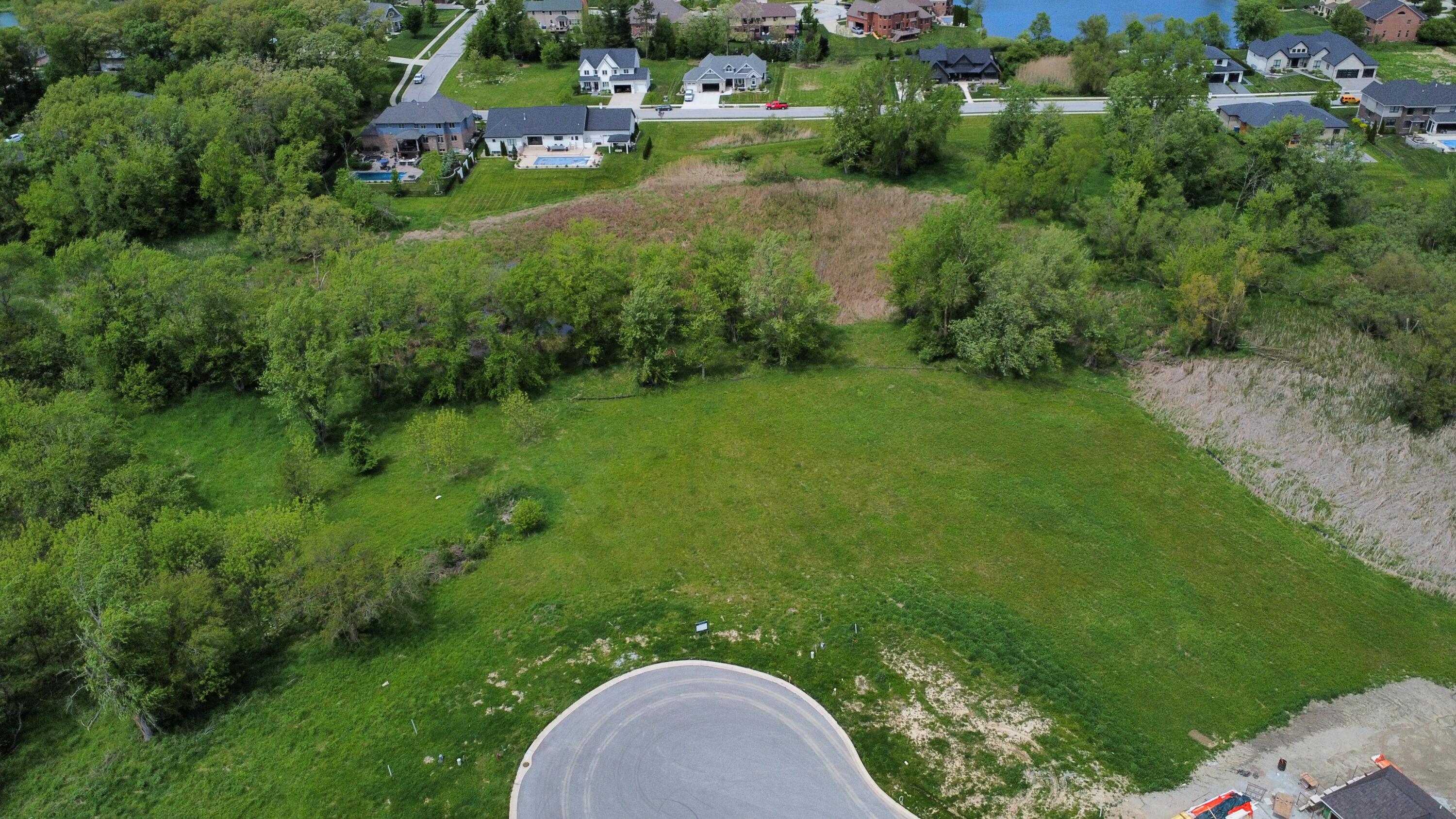 9245 Sublime Court St. John, IN 46373 - Photo 1 of 5 an aerial view of residential house with outdoor space and trees all around