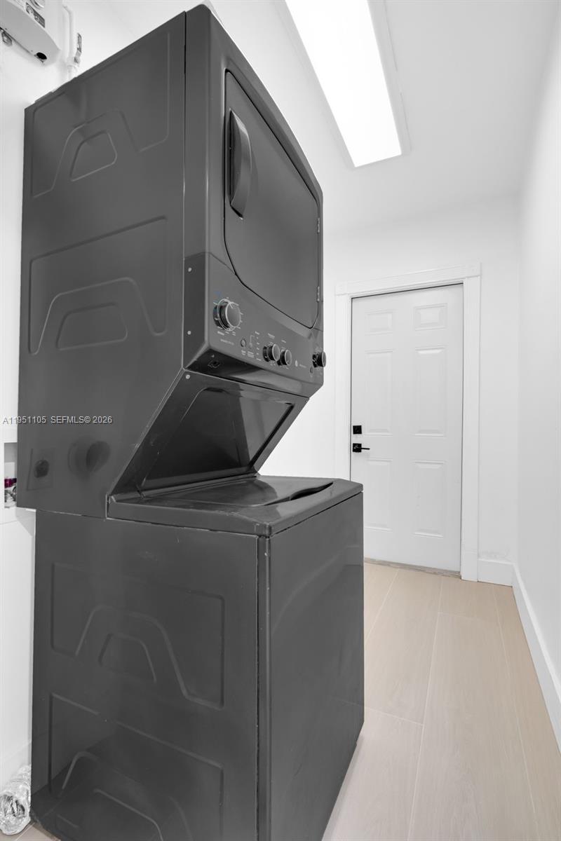 1293 Southwest 22nd Avenue Miami, FL 33135 - Photo 23 of 56 a kitchen with a refrigerator and a sink