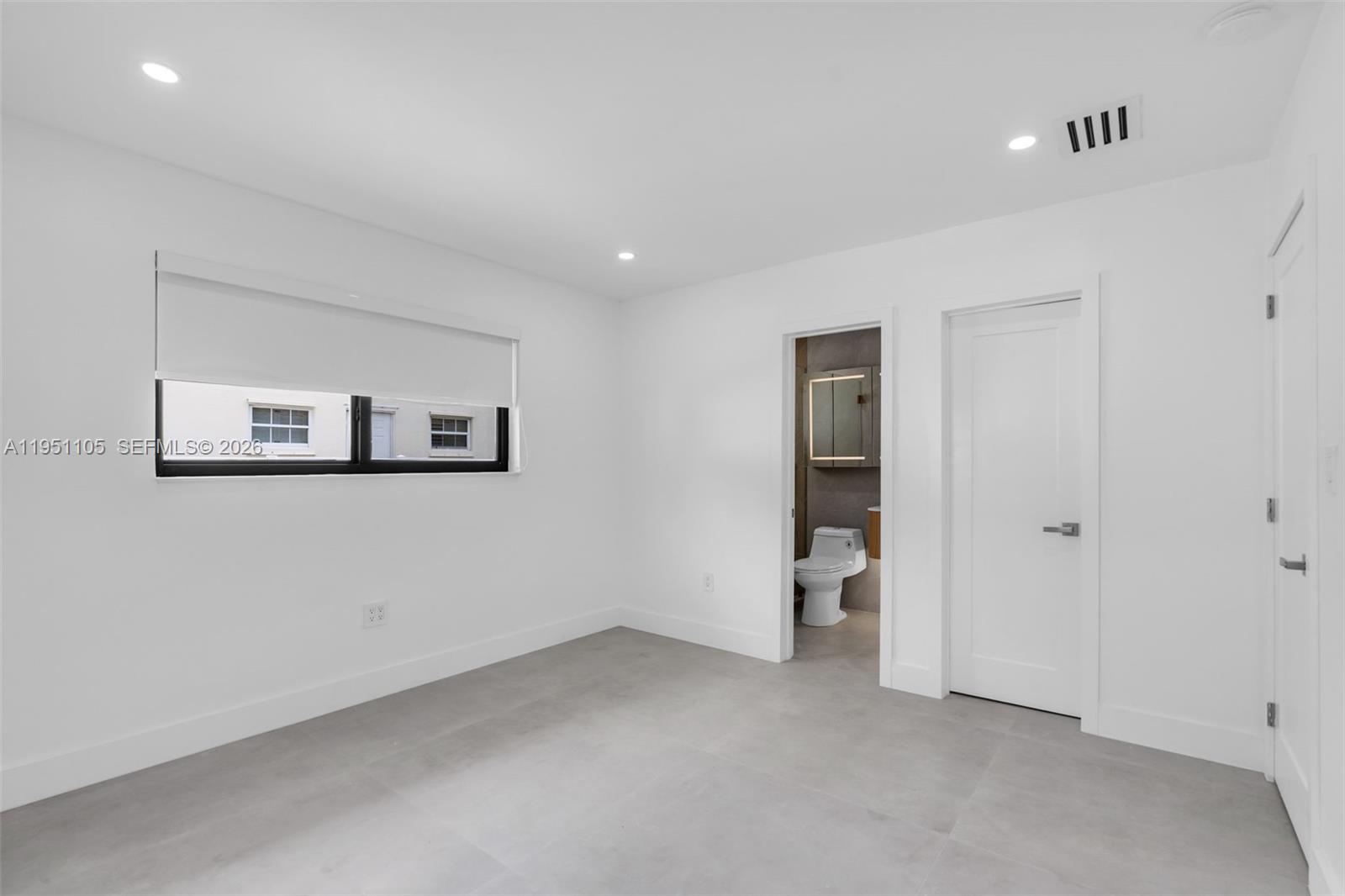 1293 Southwest 22nd Avenue Miami, FL 33135 - Photo 37 of 56 a view of an empty room with closet and a window