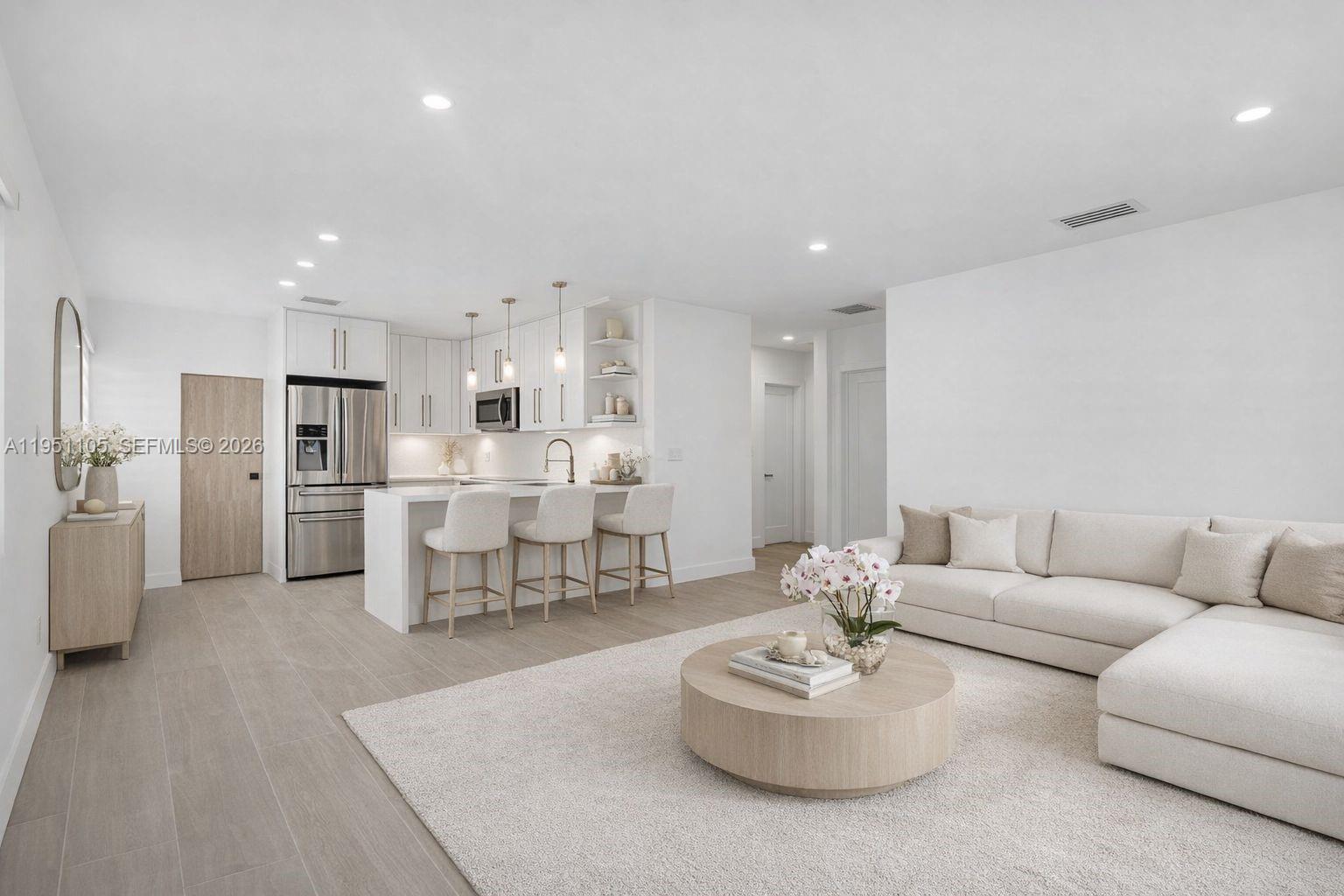 1293 Southwest 22nd Avenue Miami, FL 33135 - Photo 5 of 56 a living room with furniture kitchen and a dining table with kitchen view