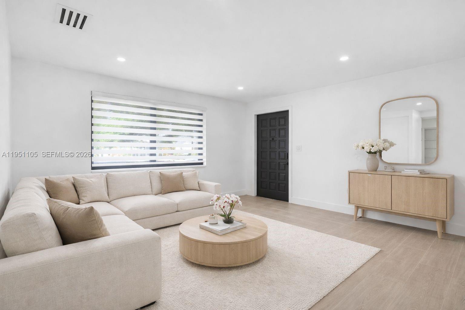 1293 Southwest 22nd Avenue Miami, FL 33135 - Photo 7 of 56 a living room with furniture and a large window