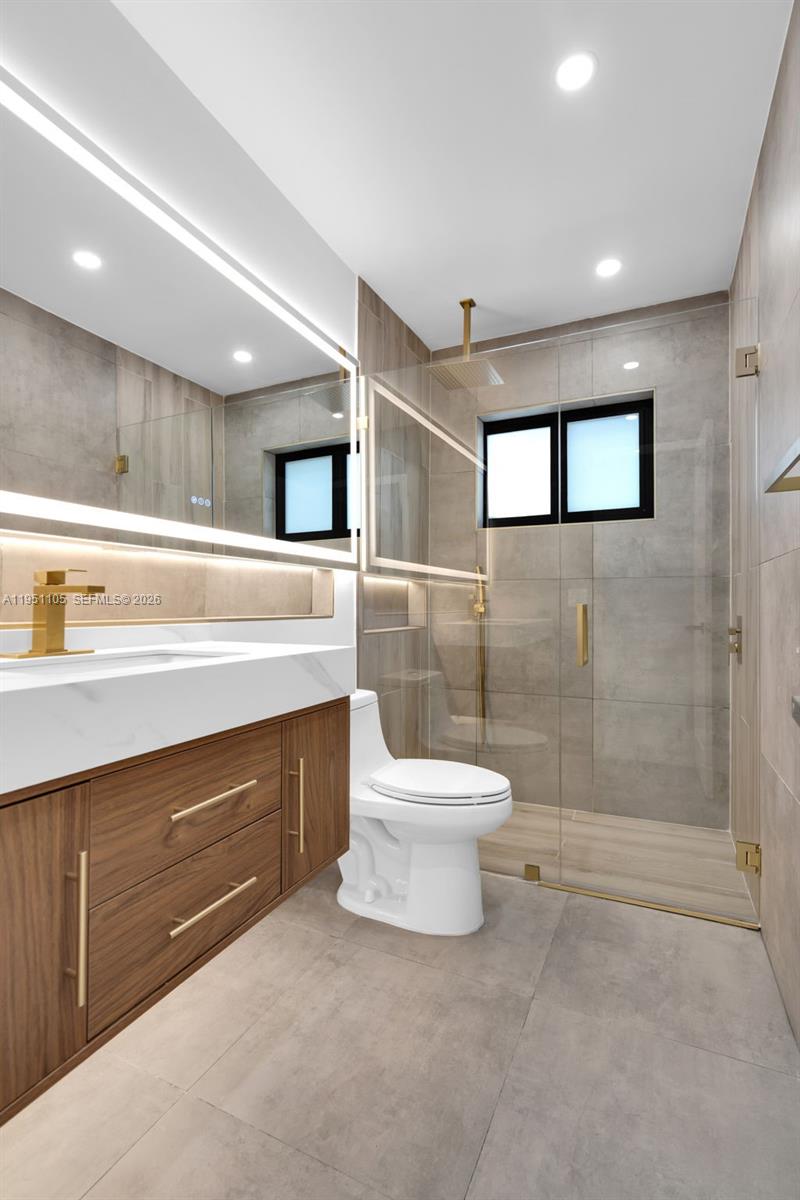 1293 Southwest 22nd Avenue Miami, FL 33135 - Photo 10 of 56 a bathroom with a sink a toilet and a shower