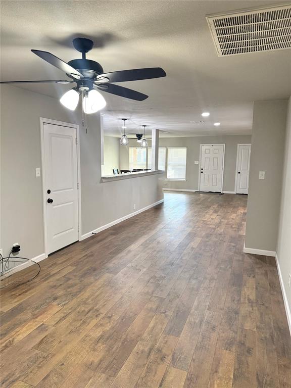 1804 Ransom Terrace Fort Worth, TX 76112 - Photo 5 of 9 an empty room with fan and windows