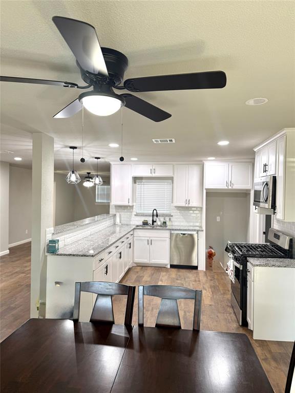 1804 Ransom Terrace Fort Worth, TX 76112 - Photo 7 of 9 a large kitchen with a table and chairs in it