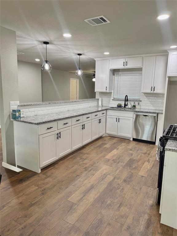 1804 Ransom Terrace Fort Worth, TX 76112 - Photo 9 of 9 a large kitchen with granite countertop a stove top oven a sink a counter space and cabinets