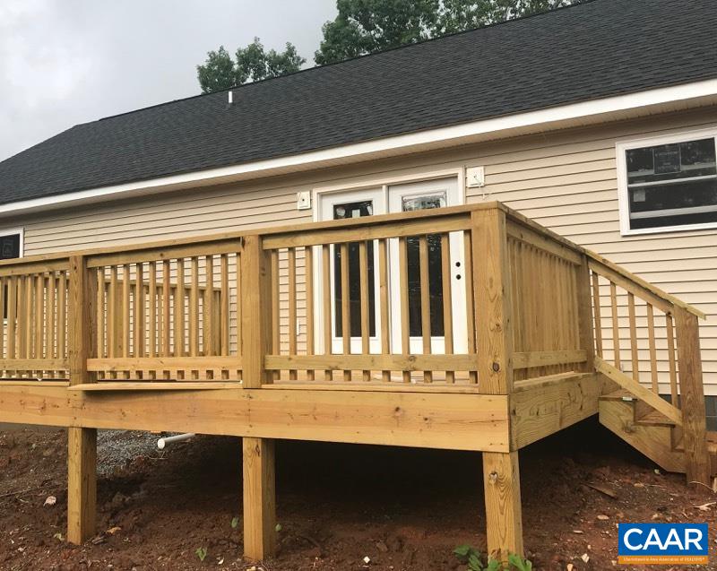 3051 Welsh Run Road Ruckersville, VA 22968 - Photo 5 of 17 a view of balcony with table and chairs