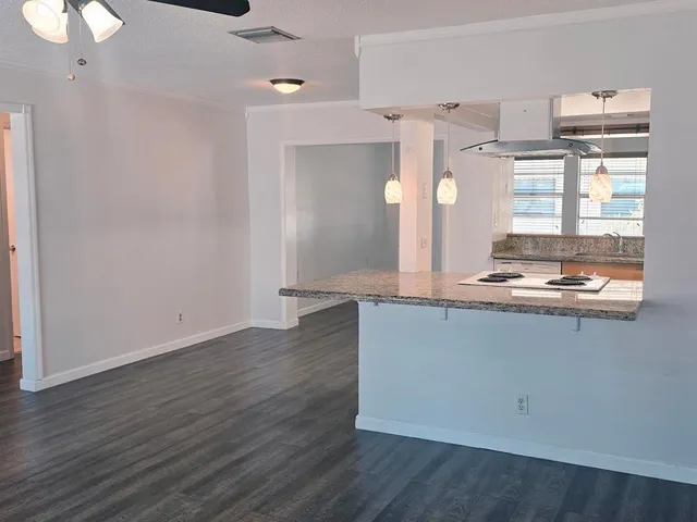 a living room with hard wood floors