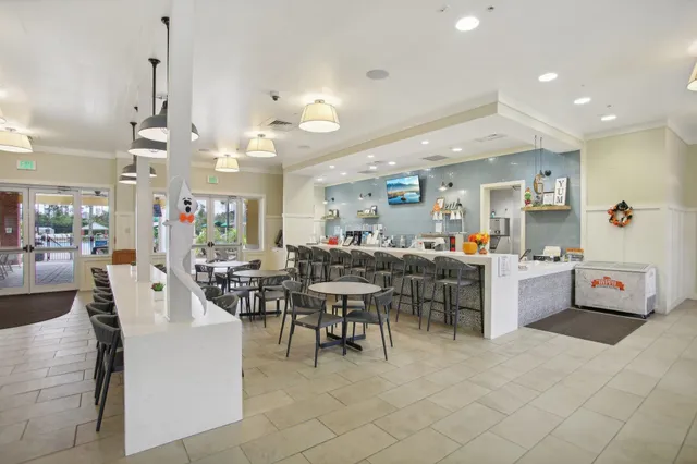a large kitchen with a table and chairs