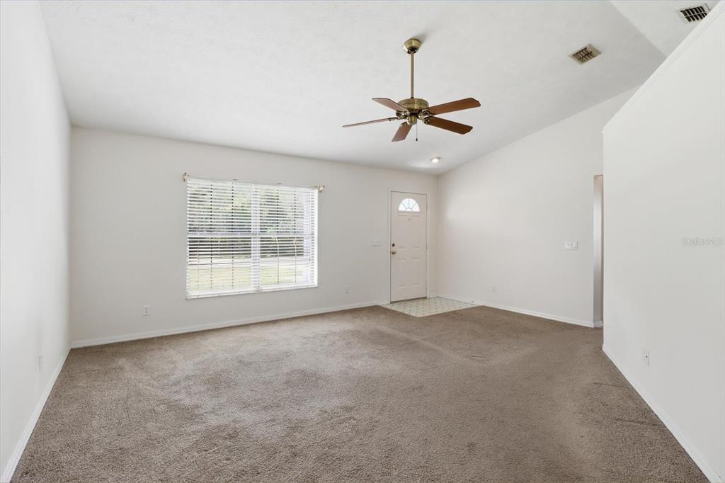 6355 East Rush Street Inverness, FL 34452 - Photo 6 of 27 a view of an empty room with a window