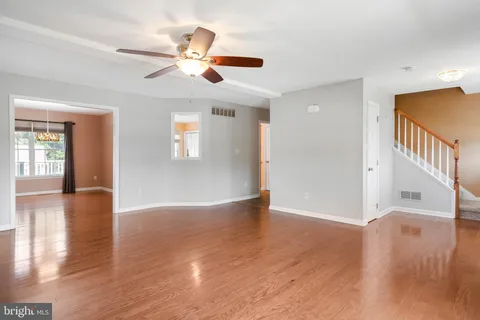 a view of an entryway with wooden floor