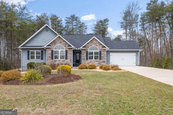 a house view with a garden space