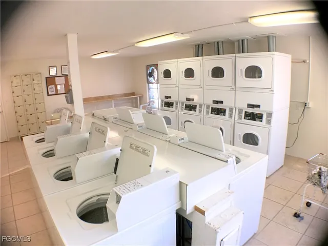 a bathroom with a sink and a washer dryer