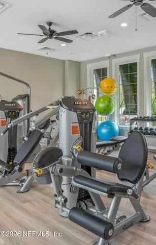 a room with gym equipment and a mirror
