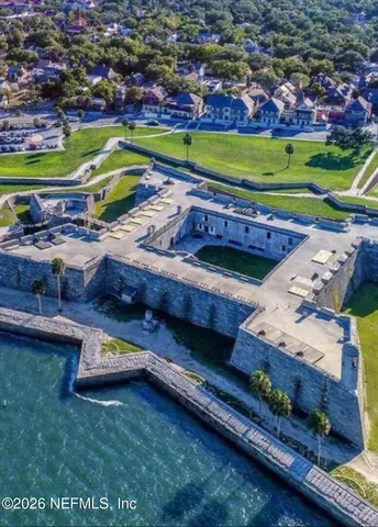 a view of a swimming pool with a yard