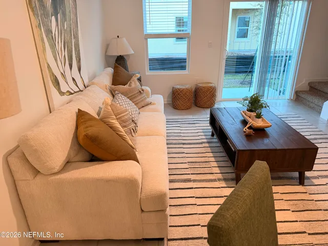 a living room with furniture and a window