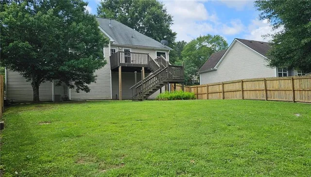 a view of a backyard with a garden and plants