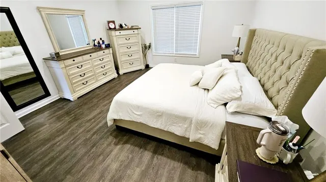 a bedroom with a bed and a baby crib