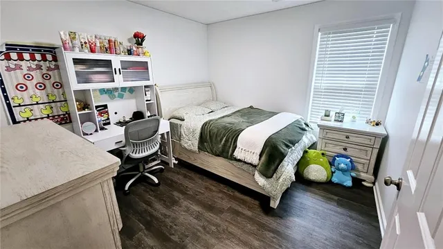 a bedroom with a bed and a table in it