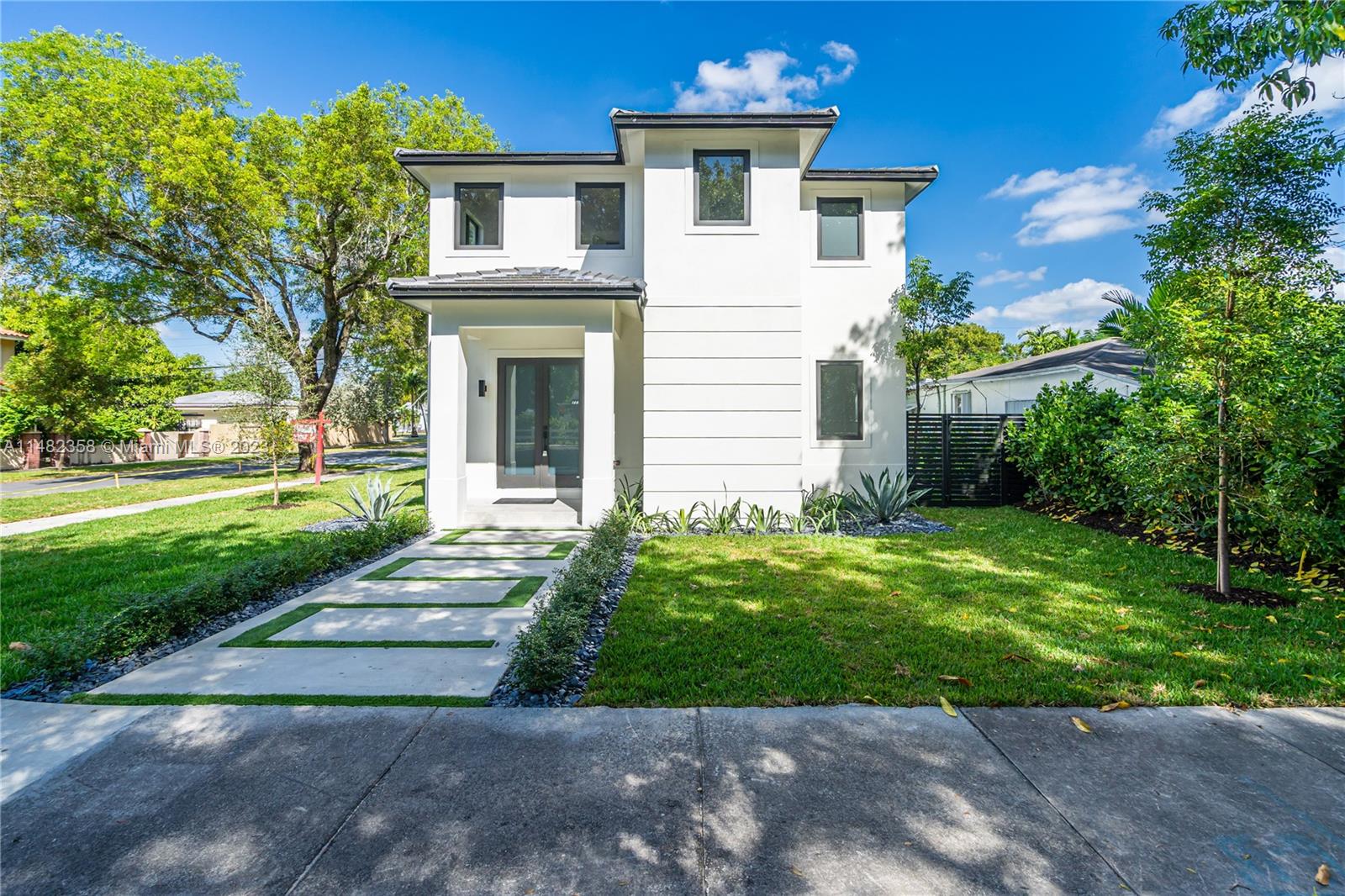 5241 Southwest 6th Street Miami, FL 33134 - Photo 1 of 38 a front view of a house with a yard