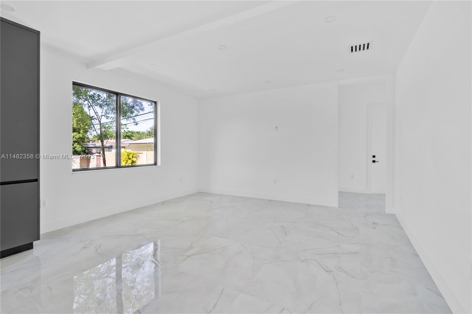 5241 Southwest 6th Street Miami, FL 33134 - Photo 11 of 38 an empty room with windows