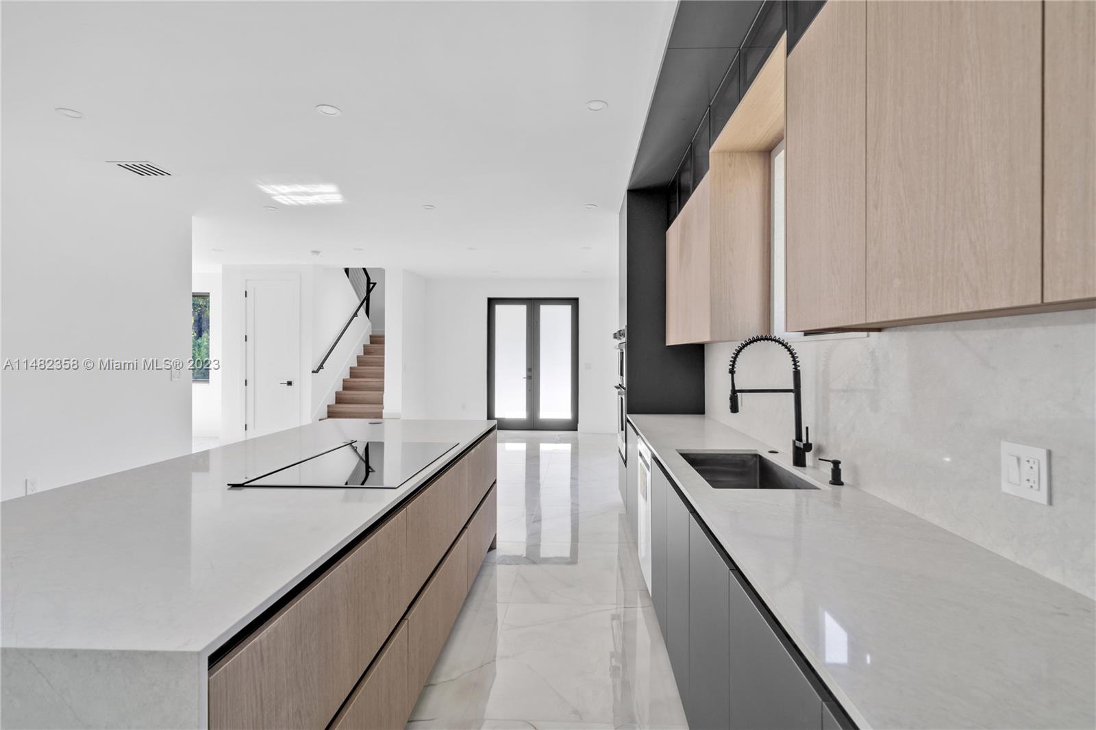 5241 Southwest 6th Street Miami, FL 33134 - Photo 15 of 38 a kitchen with counter top space and stainless steel appliances