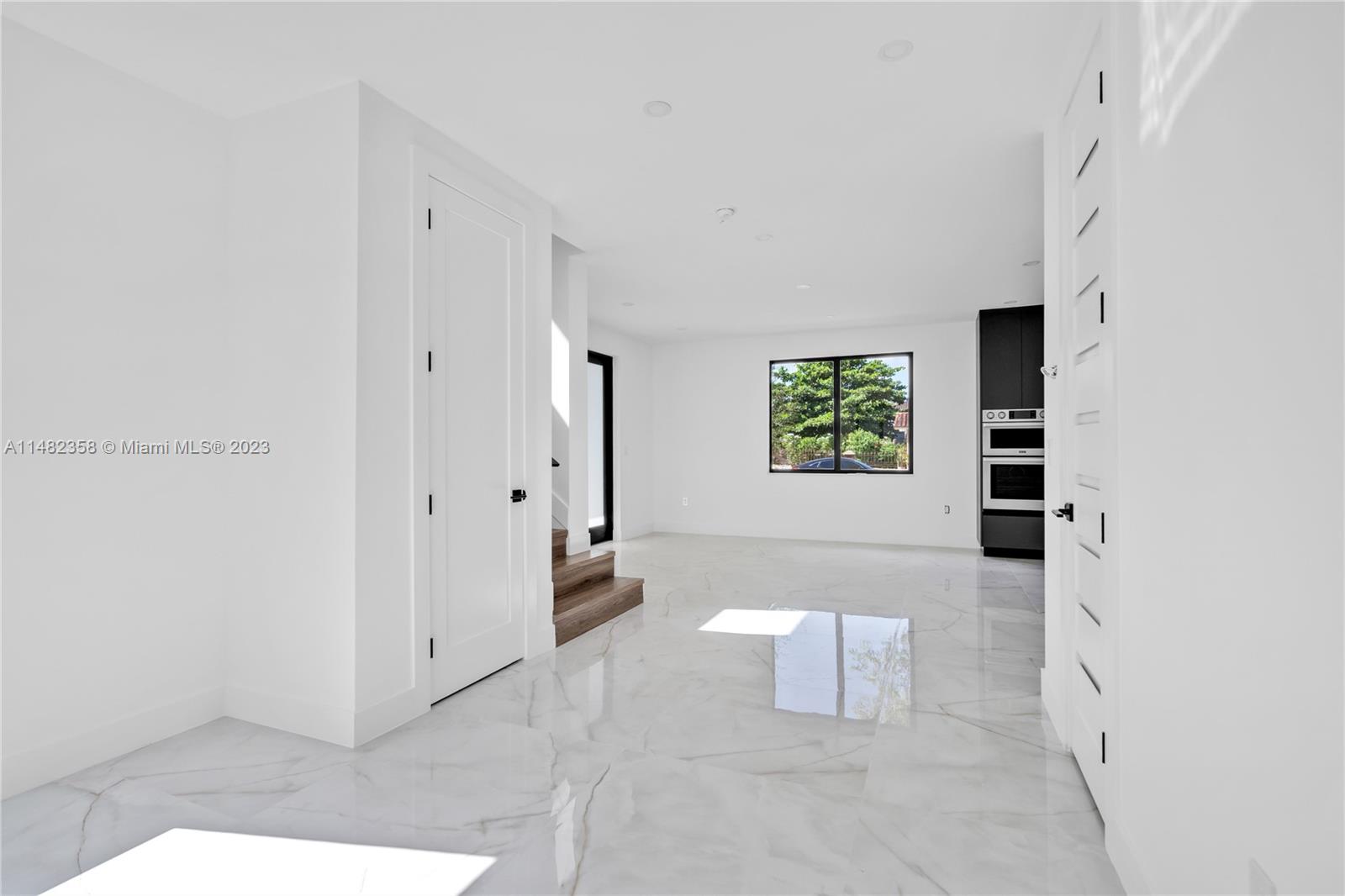 5241 Southwest 6th Street Miami, FL 33134 - Photo 17 of 38 a view of a hallway with bathroom and a window