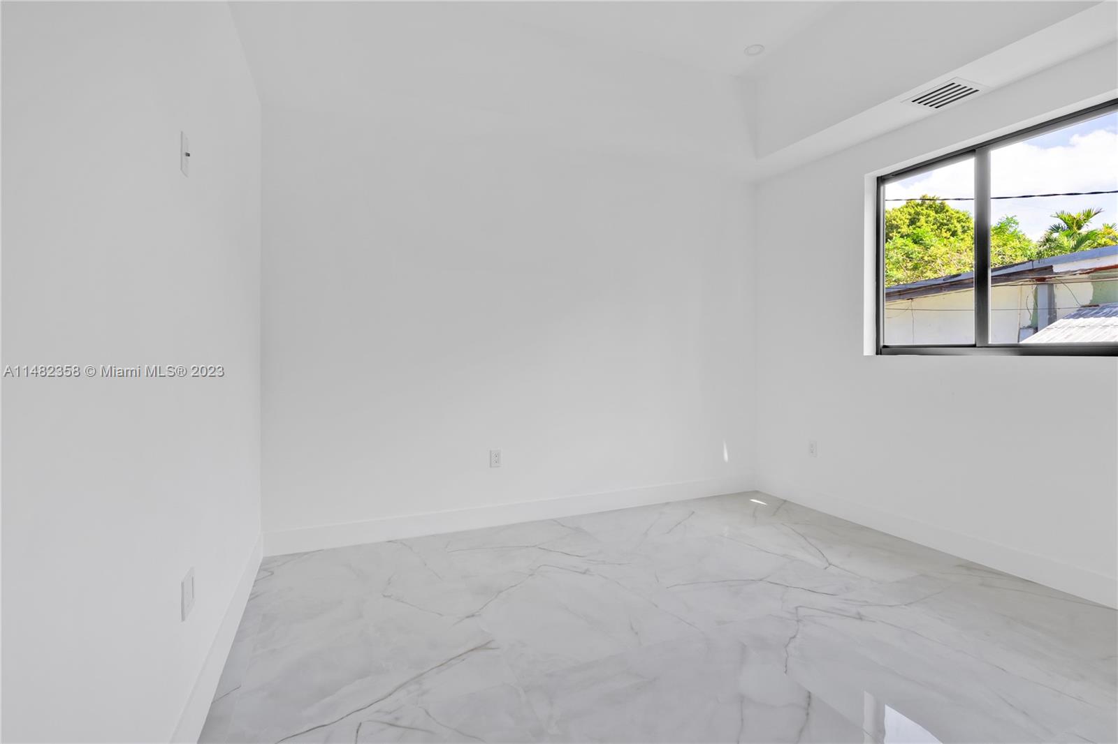 5241 Southwest 6th Street Miami, FL 33134 - Photo 20 of 38 an empty room with a window