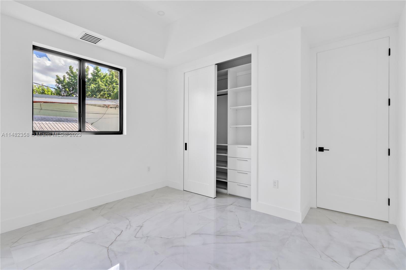 5241 Southwest 6th Street Miami, FL 33134 - Photo 21 of 38 an empty room with windows