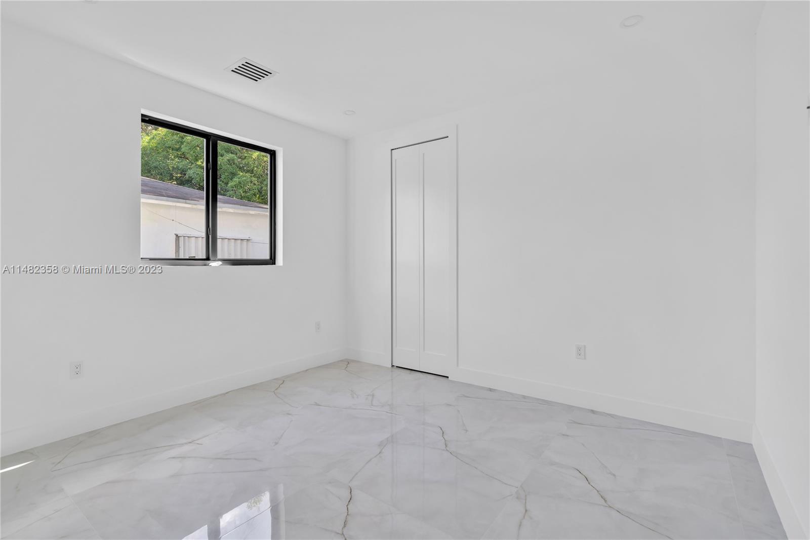 5241 Southwest 6th Street Miami, FL 33134 - Photo 22 of 38 an empty room with windows