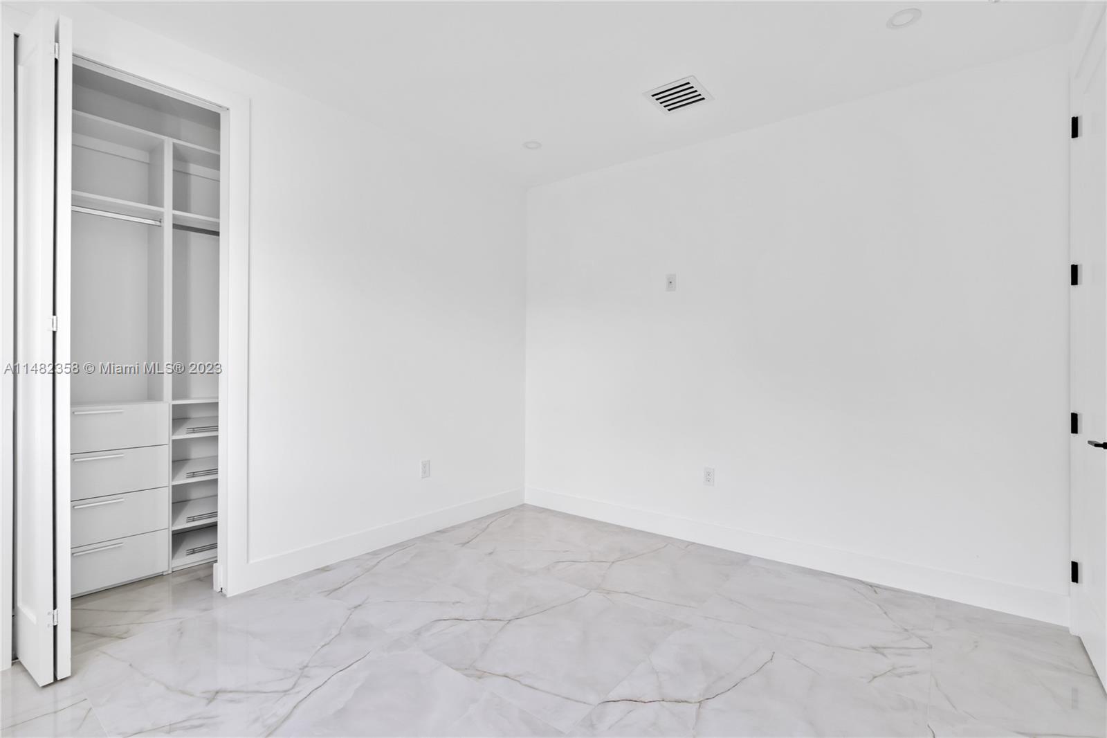 5241 Southwest 6th Street Miami, FL 33134 - Photo 23 of 38 an empty room with closet